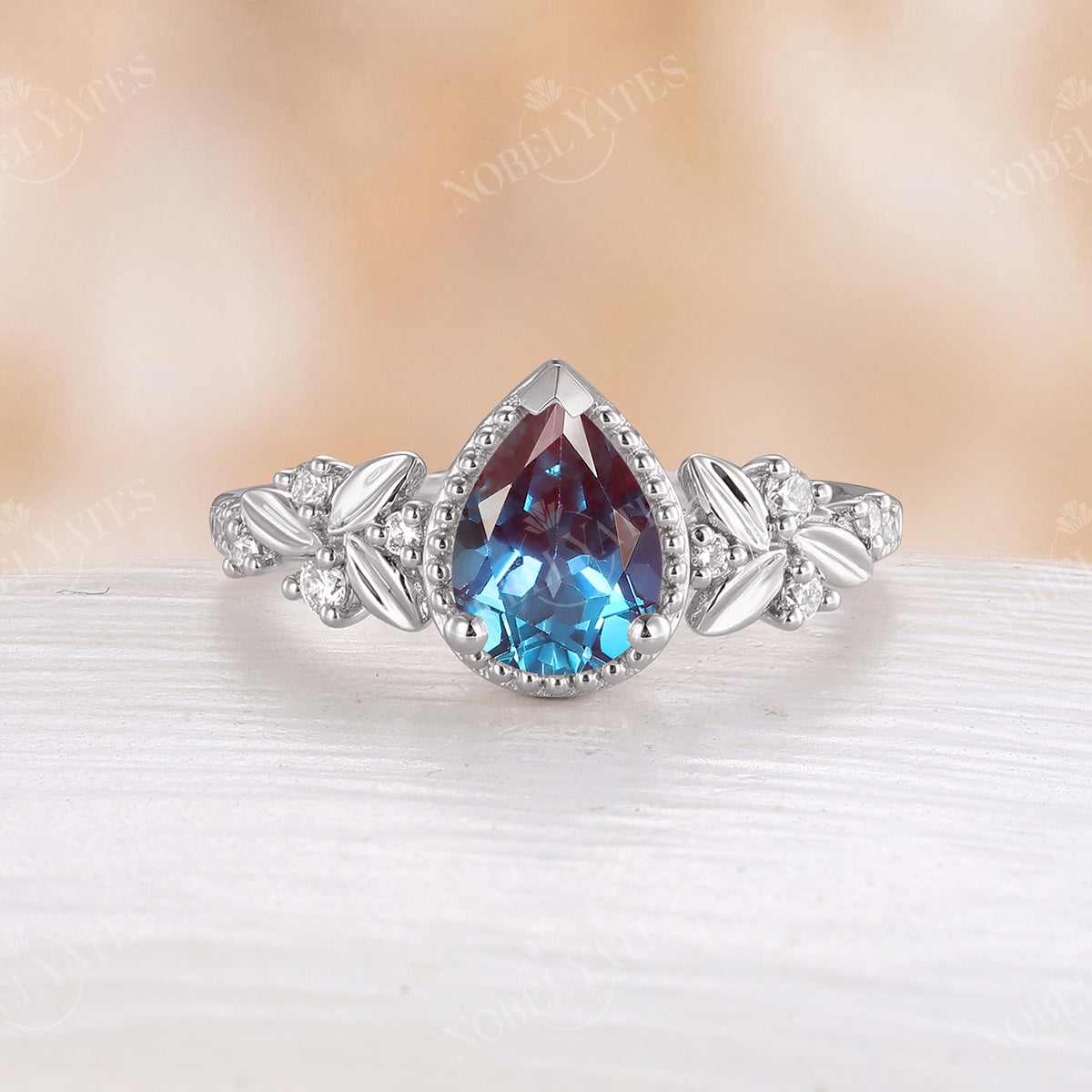 Lab Alexandrite Pear Shape Engagement Ring Leaf And Moissanite Band