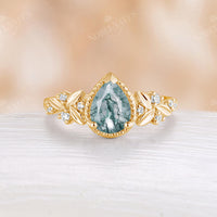 Lab Alexandrite Pear Shape Engagement Ring Leaf And Moissanite Band
