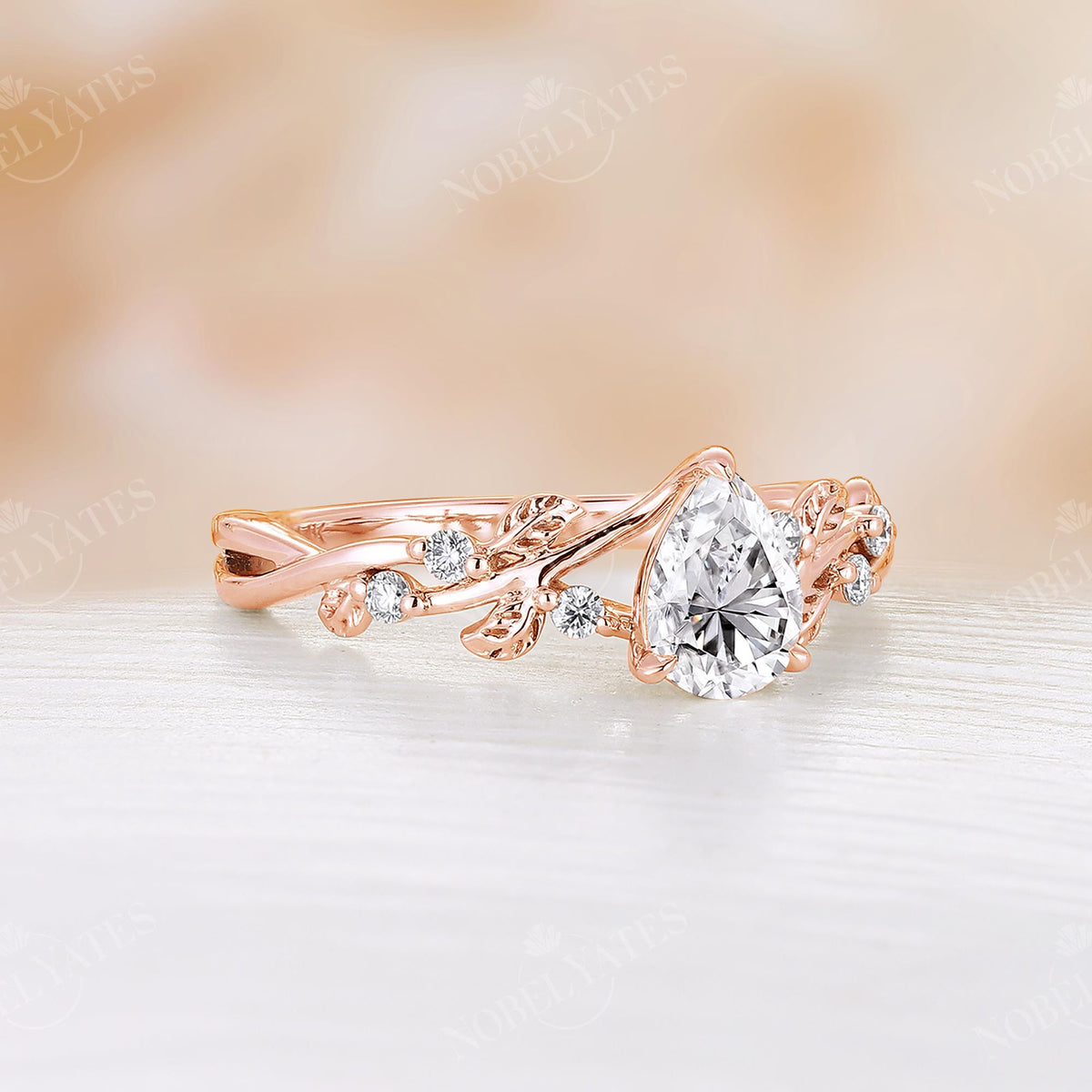 Pear Cut Moissanite Rose Gold Leaf Twist Design Engagement Ring
