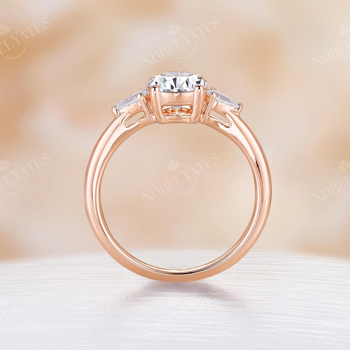 Classic Round Moissanite Rose Gold Three Stone Engagement Ring