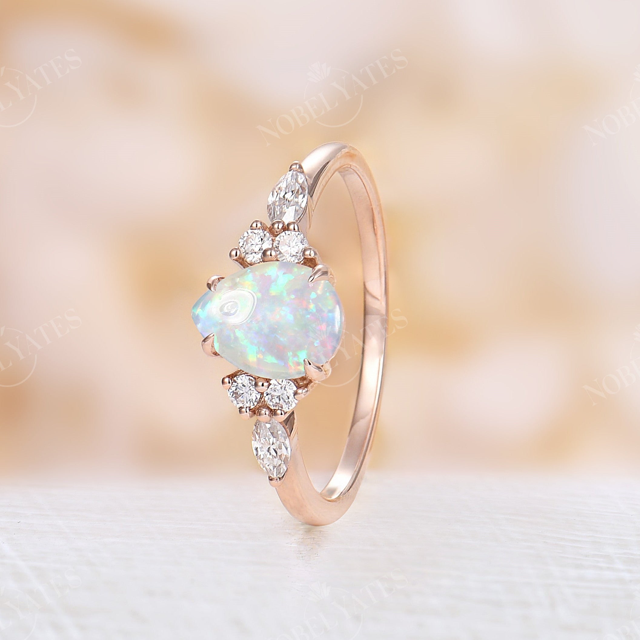 Diamond ring with opal deals side stones