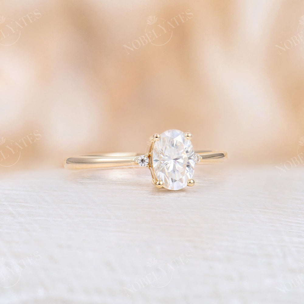 
                  
                    Oval Moissanite Rose Gold Three Stone Ring
                  
                