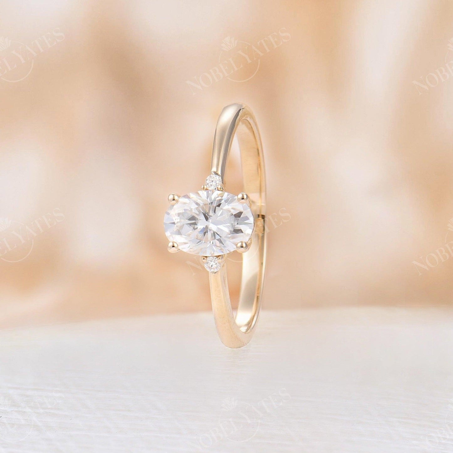 
                  
                    Oval Moissanite Rose Gold Three Stone Ring
                  
                