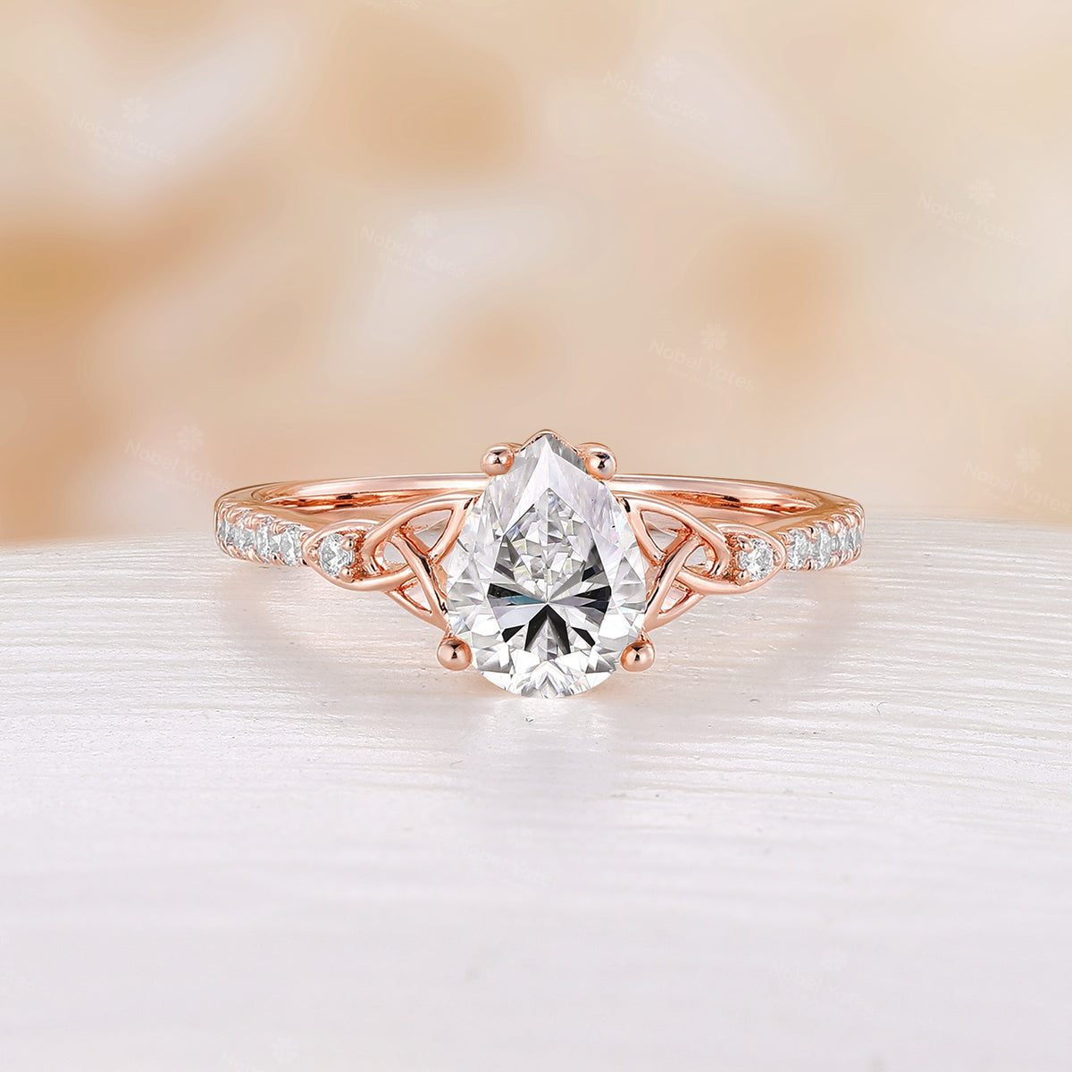 Celtic Inspired Pear Cut Moissanite Engagement Ring Rose Gold Pave Band