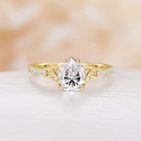 Celtic Inspired Pear Cut Moissanite Engagement Ring Rose Gold Pave Band