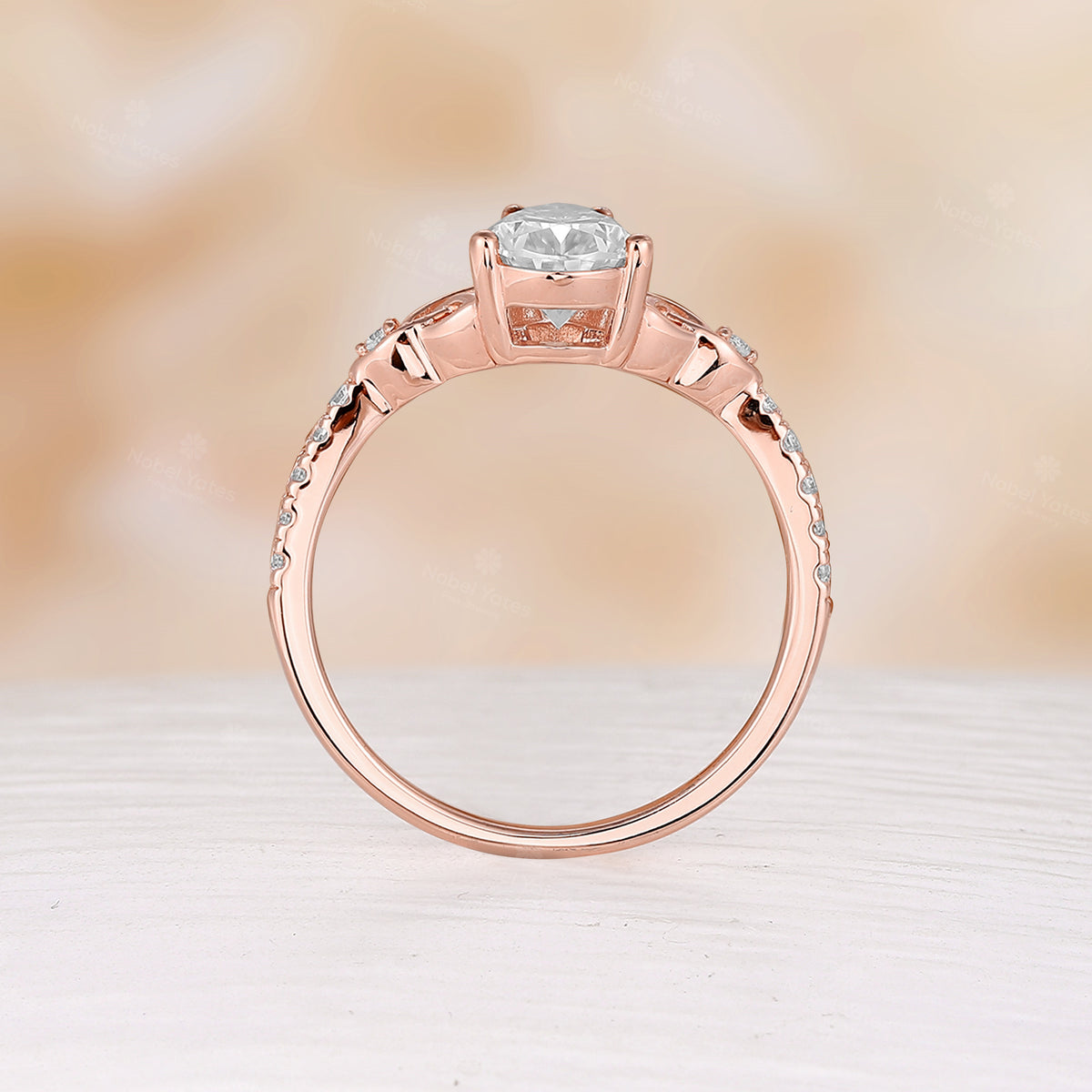 Celtic Inspired Pear Cut Moissanite Engagement Ring Rose Gold Pave Band