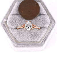 Celtic Inspired Pear Cut Moissanite Engagement Ring Rose Gold Pave Band