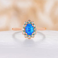 Blue Oval Lab Opal Lab Emerald & Moissanite Halo Engagement Ring Rose Gold