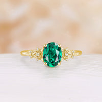 Nature Inspired Oval Cut Lab Emerald Foral Engagement Ring Rose Gold Side Stone