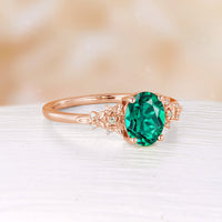 Nature Inspired Oval Cut Lab Emerald Foral Engagement Ring Rose Gold Side Stone