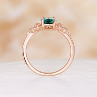 Nature Inspired Oval Cut Lab Emerald Foral Engagement Ring Rose Gold Side Stone