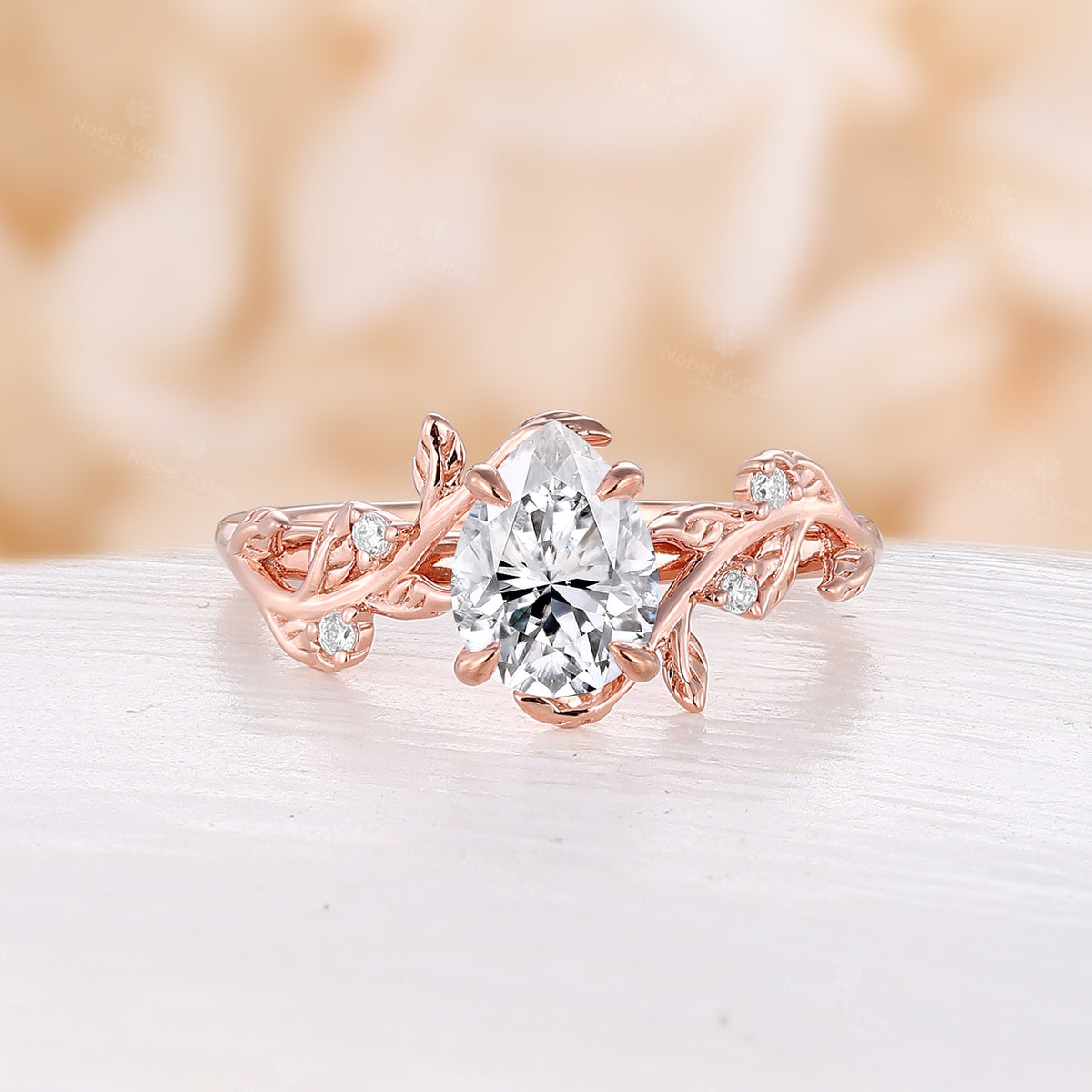 Nature Inspired Pear Moissanite Engagement Ring Rose Gold Bypass Leaf Band