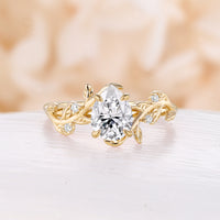 Nature Inspired Pear Moissanite Engagement Ring Rose Gold Bypass Leaf Band