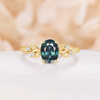 Nature Inspired Oval Cut Teal Sapphire Engagement Ring Leaf Design