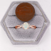 Oval Cut White Opal Engagement Ring Moissanite Side Stones Split Rose Gold Band